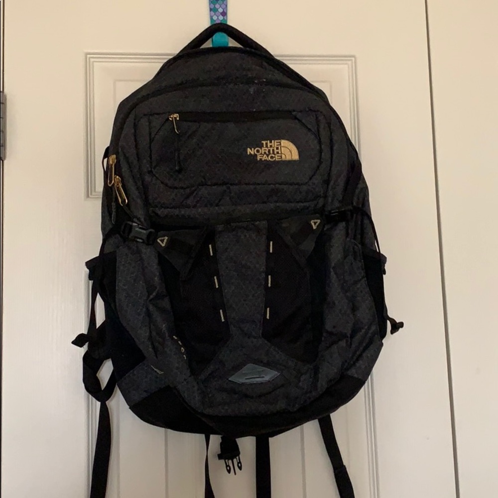 The North Face black backpack.